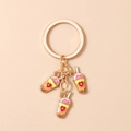Detailed view of golden heart milk tea charms on a stylish keychain for bags - Purple Rose Red Milk Tea