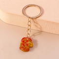 Sparkling gold glitter mitten keychain with festive red patterns and golden keyring - Christmas Mittens