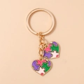 Détail d'un porte-clés puzzle en forme de cœur avec émail coloré sur métal doré poli - Style de Puzzle en Cœur Violet