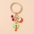 Detail view of summer beach keychain with palm tree, coconut, and sunglasses charms - Sunglasses Coconut Tree