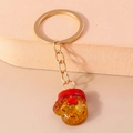 Cute brown glitter resin glove keychain with golden metal ring and red festive trim - Christmas Heart Glove