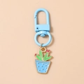 Detail of cute green cactus keychain with blue polka dot pot and metallic clasp - Blue