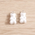 Set of two white resin gummy bear charms with silver metal rings on a wood background - 10 Pieces Pack / White