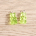 Light green translucent gummy bear resin charms with silver rings on wood surface - 10 Pieces Pack / Green