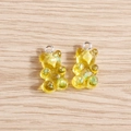 Detailed macro view of yellow transparent resin gummy bears with colorful glitter sequins - 10 Pieces Pack / Yellow