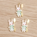 Detailed macro view of three white rabbit enamel charms with golden spoons for DIY jewelry - Spoon Style / 10 Pieces Pack / Green