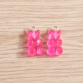 Macro detail of two pink resin gummy bear charms with silver loops for DIY jewelry - 10 Pieces Pack / Rose Red