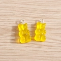 Close-up of translucent yellow resin gummy bear charms with silver metal rings for DIY jewelry - 10 Pieces Pack / Yellow