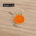 Detail of orange enamel fruit pendant with weight 1.5g and size 20mm x 17mm - Orange