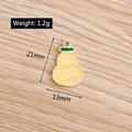 Detail view of pear-shaped alloy pendant with yellow enamel and green leaf design - Pear
