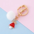 Christmas keychain with white faux fur ball and red reindeer enamel charm on gold ring - Hat