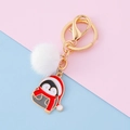 Porte-clés de Noël avec pompon blanc et pendentif pingouin en métal doré élégant - Manchot