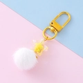 Star-shaped keychain accessory with soft white pompom and golden rotating clasp - White