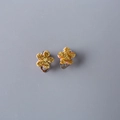 Sparkly gold flower clip-on earrings for kids with glitter finish and silver metal base - Gold Flower
