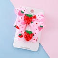 Pink handmade strawberry bow hair clips with glitter sequins on a decorative card - Strawberry with Bow / Strawberry Bow Hair Clip