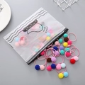 Set of colorful fuzzy ball hair ties with a matte zipper storage pouch for girls - Fur Ball Style