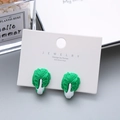 Cute green cabbage resin ear clips for girls on a white jewelry display card - Cabbage