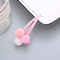 Fermaglio per capelli rosa per bambine con tre morbidi pompon dai colori pastello - Rosa