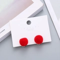 Cute red plush pom-pom clip-on earrings for kids featuring soft fuzzy ball design - Red
