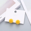 Pair of bright yellow plush pom-pom clip-on earrings on 925 silver post display card - Ginger Yellow