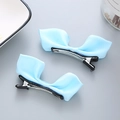 Paire de barrettes à nœuds en satin bleu clair avec pinces crocodiles en métal argenté - Bleu clair
