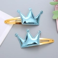 Pair of glossy blue crown hair clips for girls with golden snap clips and fine stitching - 1 Pair / Light Blue
