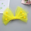 Barrette à cheveux pour enfant nœud en résille jaune avec pompons et clip crocodile en métal - Jaune
