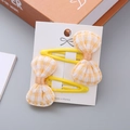 Set of 2 children's hair clips featuring yellow plaid bows on metal BB snaps - Yellow Bowknot