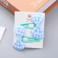 Set of two girls' mint green hair clips with blue checkered bows on display card - Blue Bow