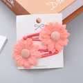 Pair of pink fabric flower hair clips with striped button centers for girls on display card - Orange Red Flower