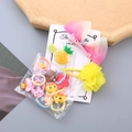 Pinza para el pelo con lazo rosa y set de gomas elásticas con motivos de dibujos - Amarillo
