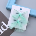 Set di due dolci fermagli per capelli con fiocco in tulle verde menta e glitter dorati - Smeraldo