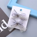 Set di due graziose mollette in tulle grigio con glitter dorati per acconciature bimba - Grigio