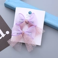 Pair of purple tulle bow hair clips with gold glitter for girls on display card - Violet