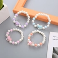 Kids colorful pearl beaded bracelets with translucent heart and star shaped charms - Star Heart Spaced Style