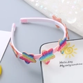 Rosa Haarreif für Kinder mit glitzernden Regenbogensternen und Anti-Rutsch-Zähnen - Stern mit dicken Streifen Farbverlauf