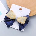 Fermaglio per capelli con fiocco vintage blu navy, tulle dorato glitterato e paillettes - Base Blu Notte Oro