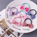 Set of 6 cute floral and plaid bow hair ties for girls on a decorative white porcelain plate - Random Plaid Style
