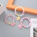 Three-piece colorful beaded children's bracelets with flower and bow charms - Pendant Style