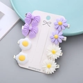 8-piece set of purple floral and bow hair clips on a handmade white display card - Elegant Series