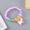 Kids colorful beaded stretch bracelet with a cute cartoon unicorn charm pendant - Purple