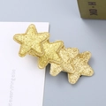 Golden glitter star hair clip with four overlapping stars for girls sparkling hair styling - Gold