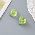Sparkly green heart clip-on earrings with pink bow for kids, pain-free resin design - Green Heart