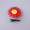 Vibrant red felt flower spring clip with a yellow smiley face for kids hairstyles - Smiley Sunflower Red