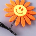 Cute orange sunflower spring hair clip with macaron colors and a smiling face design - Smiley Sunflower Orange