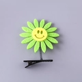 Cute sunflower spring hair clip for kids featuring a green felt flower with smiley face - Smiley Sunflower Green