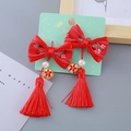 Traditional red bow hair clips with long tassels and pearls for Chinese New Year - Traditional Embroidery