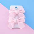 Handmade light pink ribbed fabric bow hair clips for girls on a white display card - Light Pink