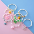Set de 7 pulseras de cuentas de colores para niñas con colgantes de dibujos y perlas falsas - Estilo de Colgante Transparente