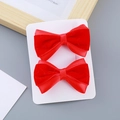 Pair of festive red velvet bow hair clips for girls with sparkling rhinestone details - Velvet Bowknot